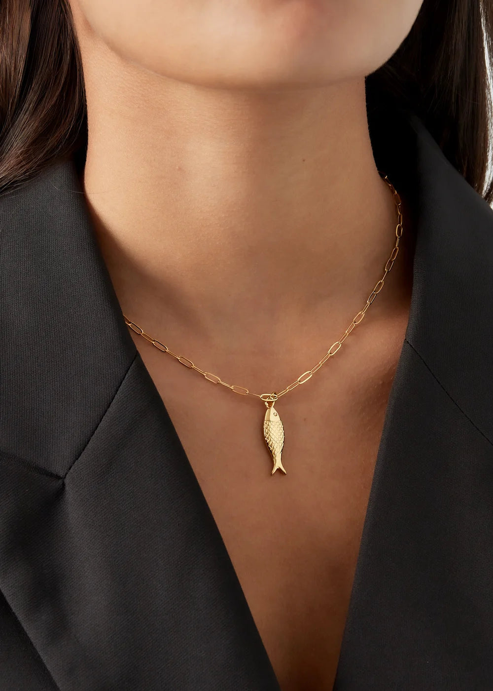 Gouden schakelketting bedel van een vis