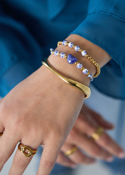 Kralenarmbandje-goud-staal-kralen-blauw